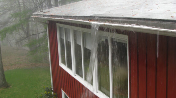 Clogged Gutter Downspout Rain Storm House